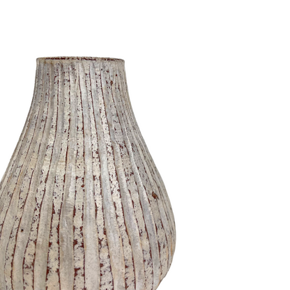 This beautiful rustic terracotta vase with neutral white tones makes it perfect for the bedroom, to place on a bedside table or as part of the living room decor. Corner