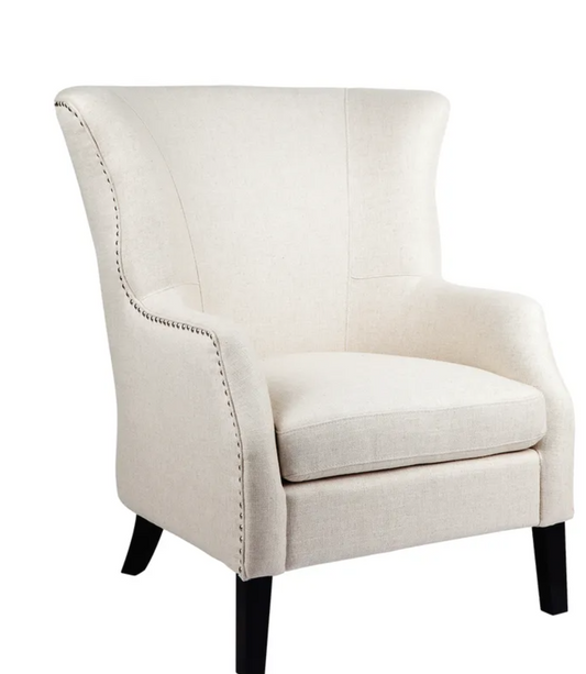 Experience luxury relaxation with the timeless Isabella Wing Back Arm Chair. Upholstered with an elegant natural linen blend and featuring a high back with wing arms, this chair is an indulgent invitation for cozy comfort. Silver detailing, black timber legs, and a plush padded seat ensure a stylish, supportive seating solution for living or bedroom spaces. Front