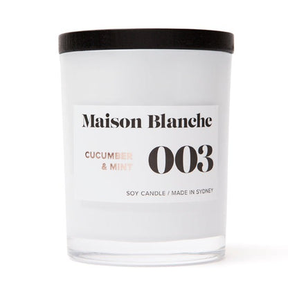 Pure soy wax is infused with expertly blended fragrance oils and carefully poured into a thick white glass vessel to deliver over 40 hours of home fragrance.  Finished with a sleek black wooden lid and packaged in Maison Blanche's signature cotton bag, this candle provides the perfect gift for any occasion.