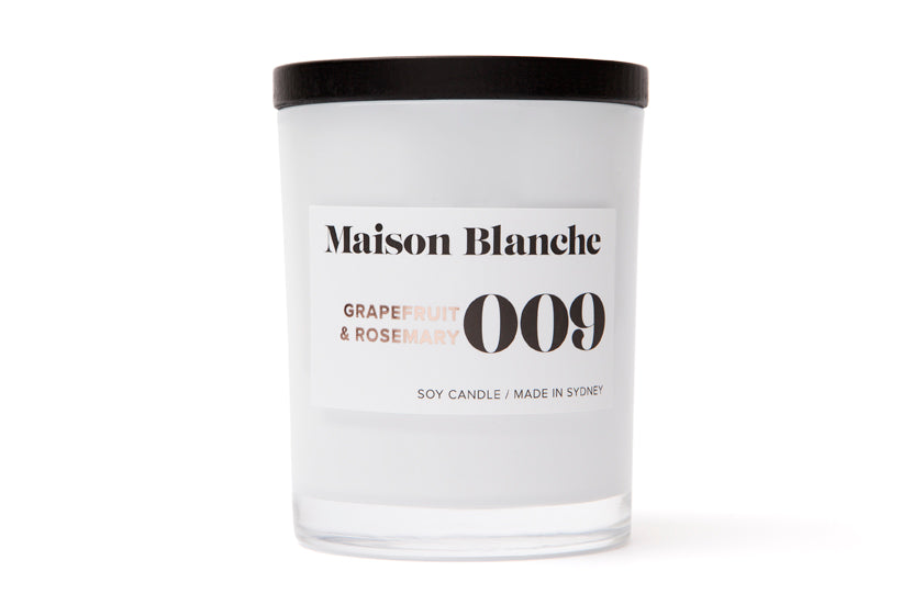 Pure soy wax is infused with expertly blended fragrance oils and carefully poured into a thick white glass vessel&nbsp;to deliver over 40 hours of home fragrance.  Finished with a sleek black wooden lid and packaged in Maison Blanche's signature cotton bag, this candle provides the perfect gift for any occasion.