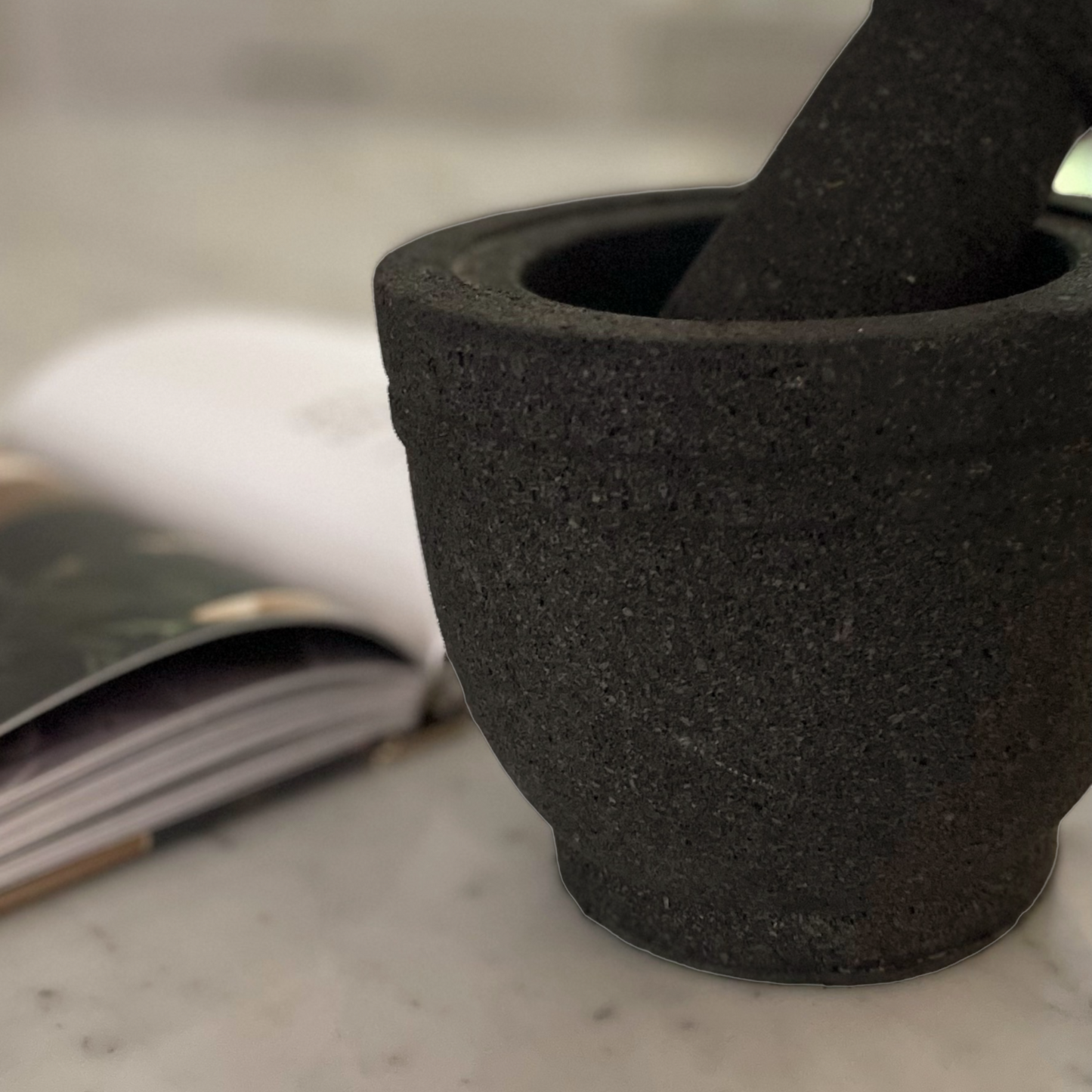 Volcanic rock mortars and pestles have been used by great cooks for thousands of years. Our Handcarved Jantung Volcanic Rock Mortar Pestle is created from a single piece of stone. In addition to being a great prep tool, it is an impressive serving dish for guacamole and other party favourites. Detail.