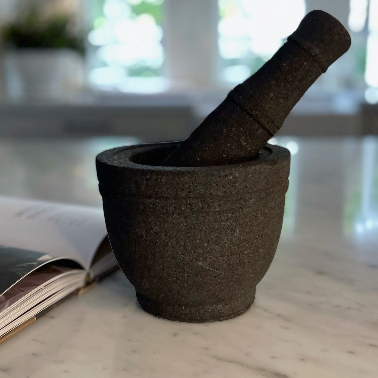 Volcanic rock mortars and pestles have been used by great cooks for thousands of years. Our Handcarved Jantung Volcanic Rock Mortar Pestle is created from a single piece of stone. In addition to being a great prep tool, it is an impressive serving dish for guacamole and other party favourites.