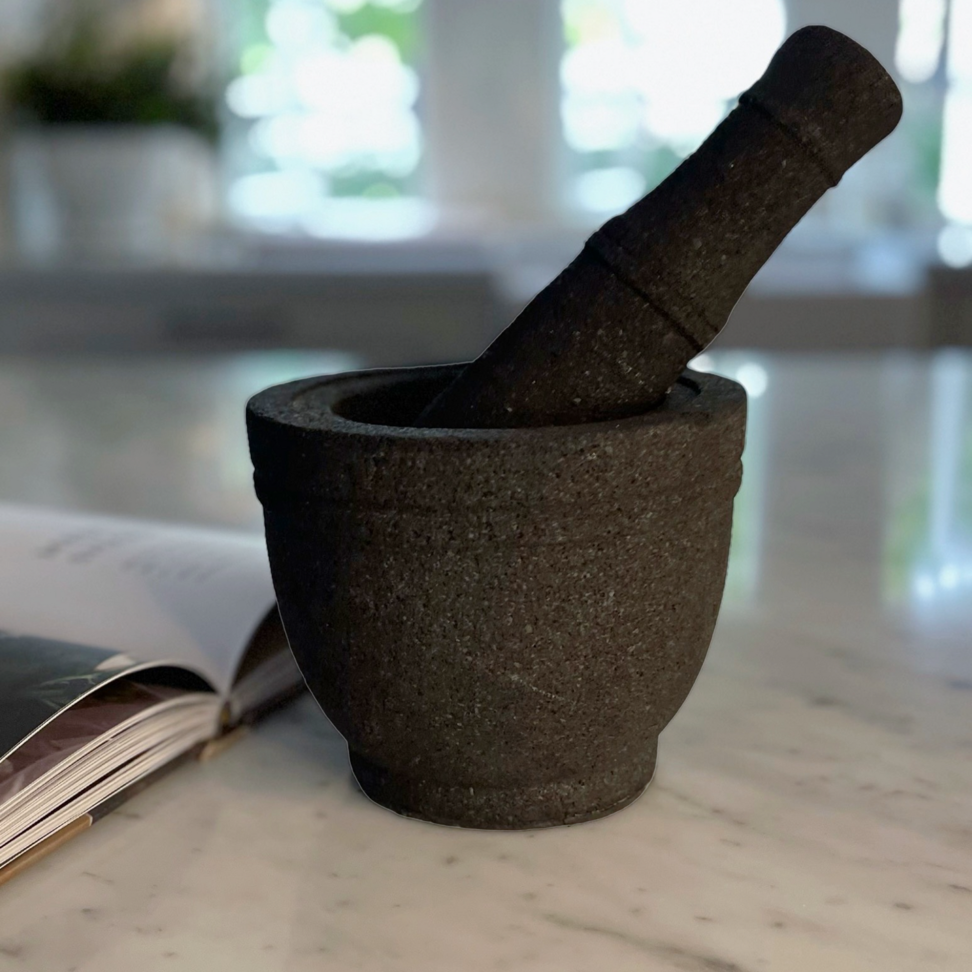 Volcanic rock mortars and pestles have been used by great cooks for thousands of years. Our Handcarved Jantung Volcanic Rock Mortar Pestle is created from a single piece of stone. In addition to being a great prep tool, it is an impressive serving dish for guacamole and other party favourites.