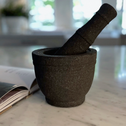 Volcanic rock mortars and pestles have been used by great cooks for thousands of years. Our Handcarved Jantung Volcanic Rock Mortar Pestle is created from a single piece of stone. In addition to being a great prep tool, it is an impressive serving dish for guacamole and other party favourites.