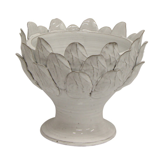 Handcrafted from terracotta and finished with an off-white glaze, this elegant Artichoke Leaf Bowl is the perfect addition to any dining or coffee table, or even a console. Its versatile design makes it equally suitable as a decorative object or a functional serving vessel.