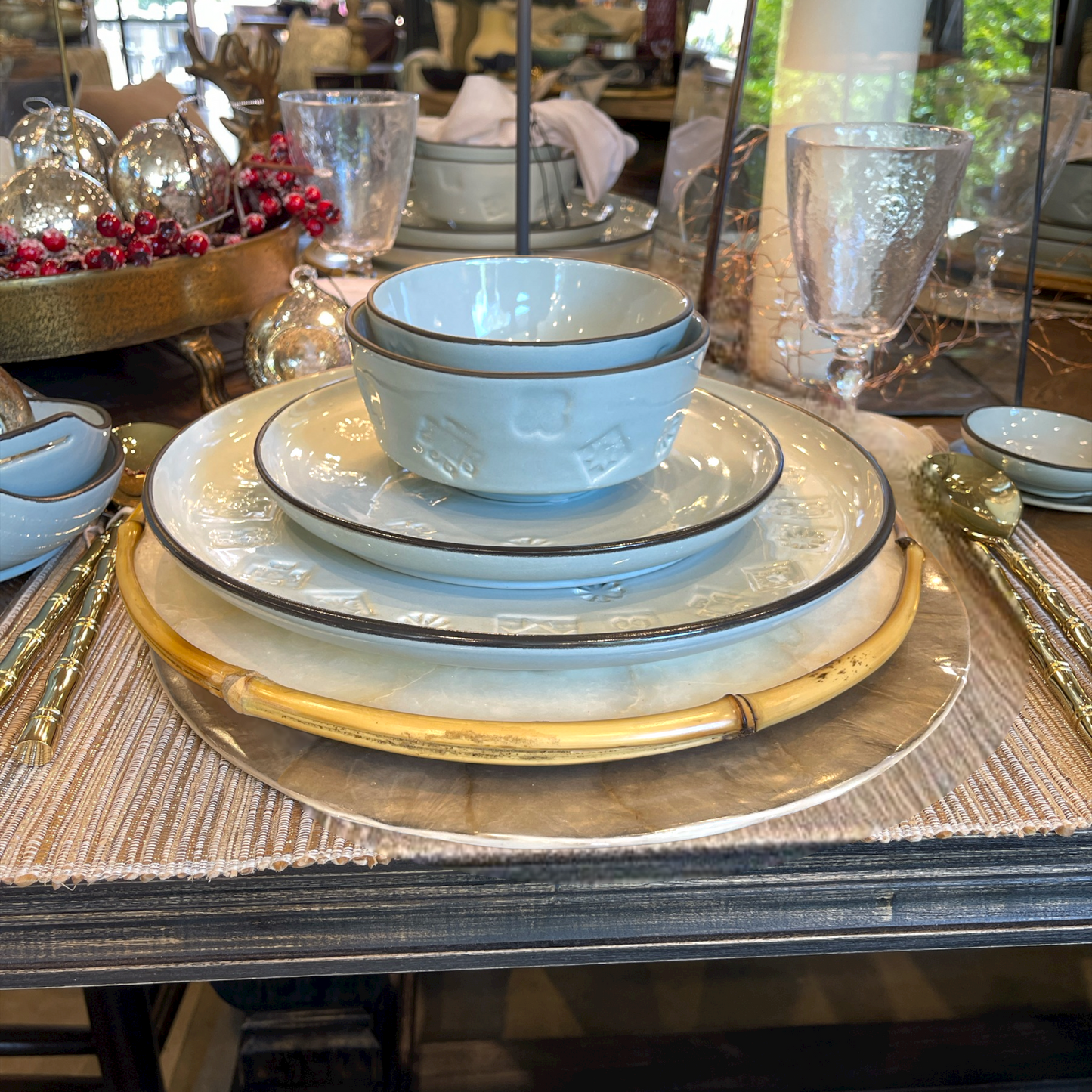 Elevate your dining experience and impress your guests with this stunning Round Capiz Charger Plate, guaranteed to add charm and elegance to any table setting. Styled low angle.