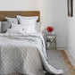 The luxurious Soho Quilt is artfully crafted with diamond-stitched quilting for an enduring and chic appearance. Composed of an exceptional mixture of 55% linen and 45% cotton, this collection offers optimal air permeability, resilience, and coziness.
