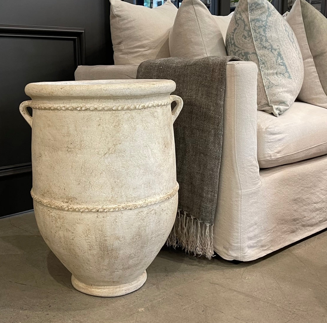 With a classic, traditional shape, this textured pot has a rustic whitewashed look giving this decorative piece character.