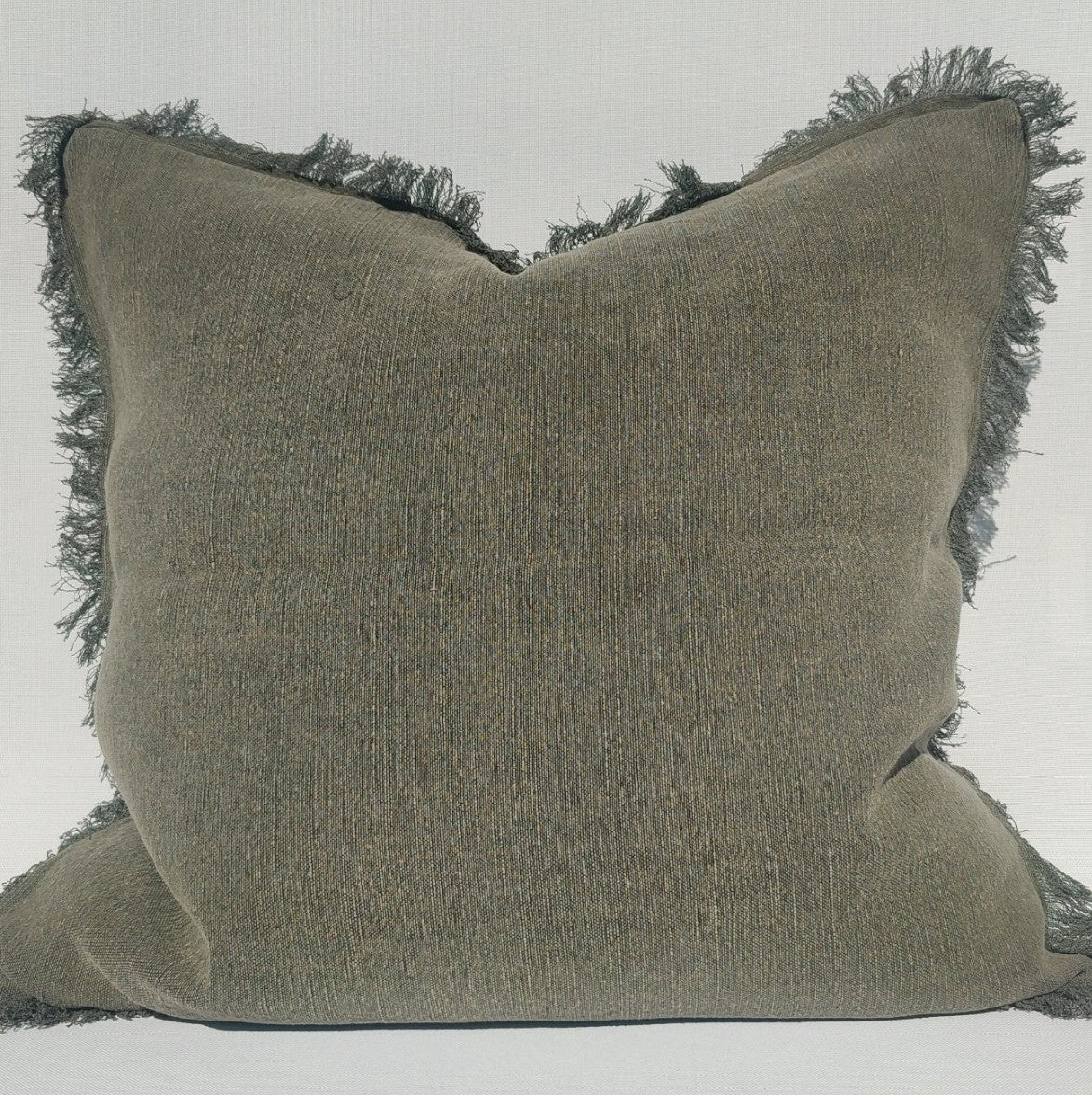 Experience the beautiful and versatile Vogue French Linen Green Cushion in a subtle stone washed hue. Its dynamic texture easily complements other textiles, making it a must-have for any home.