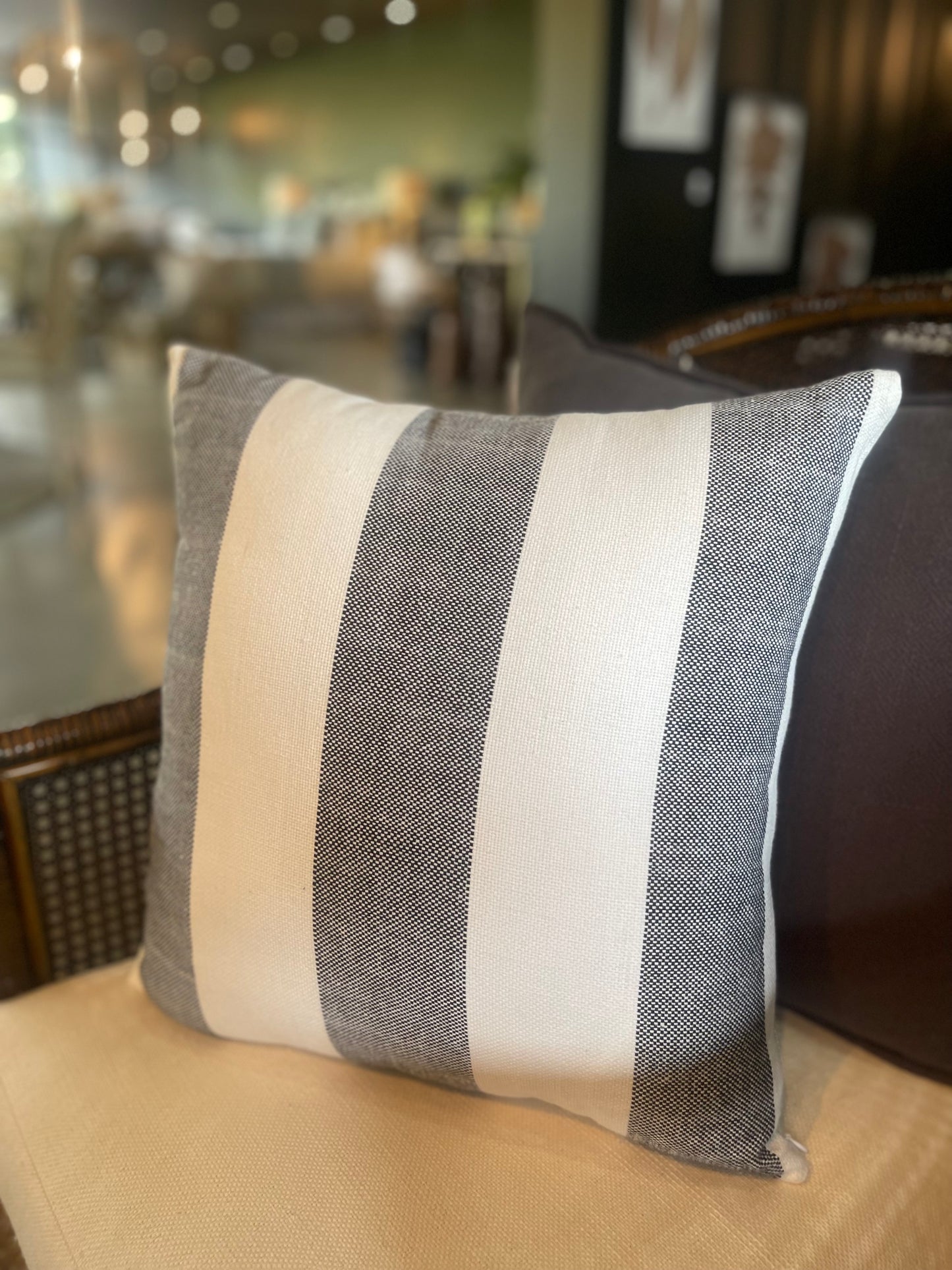 Our Lyon Handwoven Cotton Cushion boasts sleek stripes and provides versatile styling, ideal for complementing sofas and beds. Its luxurious Dacron insert adds additional comfort. Black and white coloured.