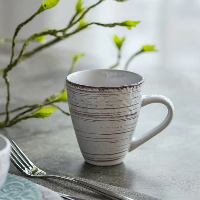 With rustic design, exquisite details and cream finish this ceramic mug is a sleek, versatile piece that adds beauty to dinner, teatime or breakfast. This stunning mug is a cool alternative for presenting your favourite drink.