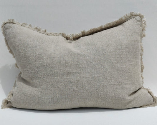 The Avril French Linen Fringed Edge Flax Lumbar Cushion boasts a custom-woven fabric. It is feather filled for a luxuriously comfortable experience and finished with a charming, rustic natural hue.