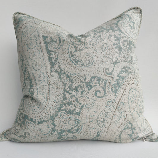 Experience the luxurious and detailed design of the Paisley Linen Sage Green Cushion, filled with soft and cozy feathers. Elevate your space and add depth to your style with this stunning cushion.