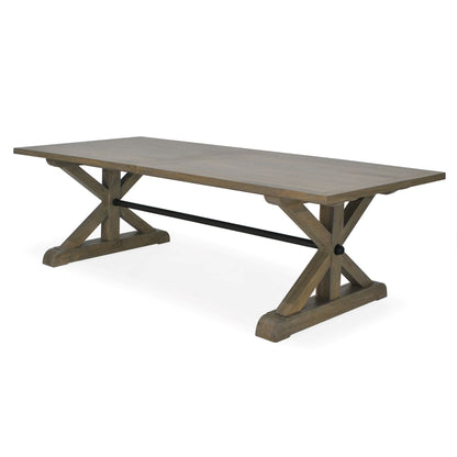 The Reims Cross Leg Dining Table creates architectural interest in your dining room. Crafted from grey fruit wood, the farmhouse style structure features cross legs supported by an iron bar that give the table character and an inviting feel. Front