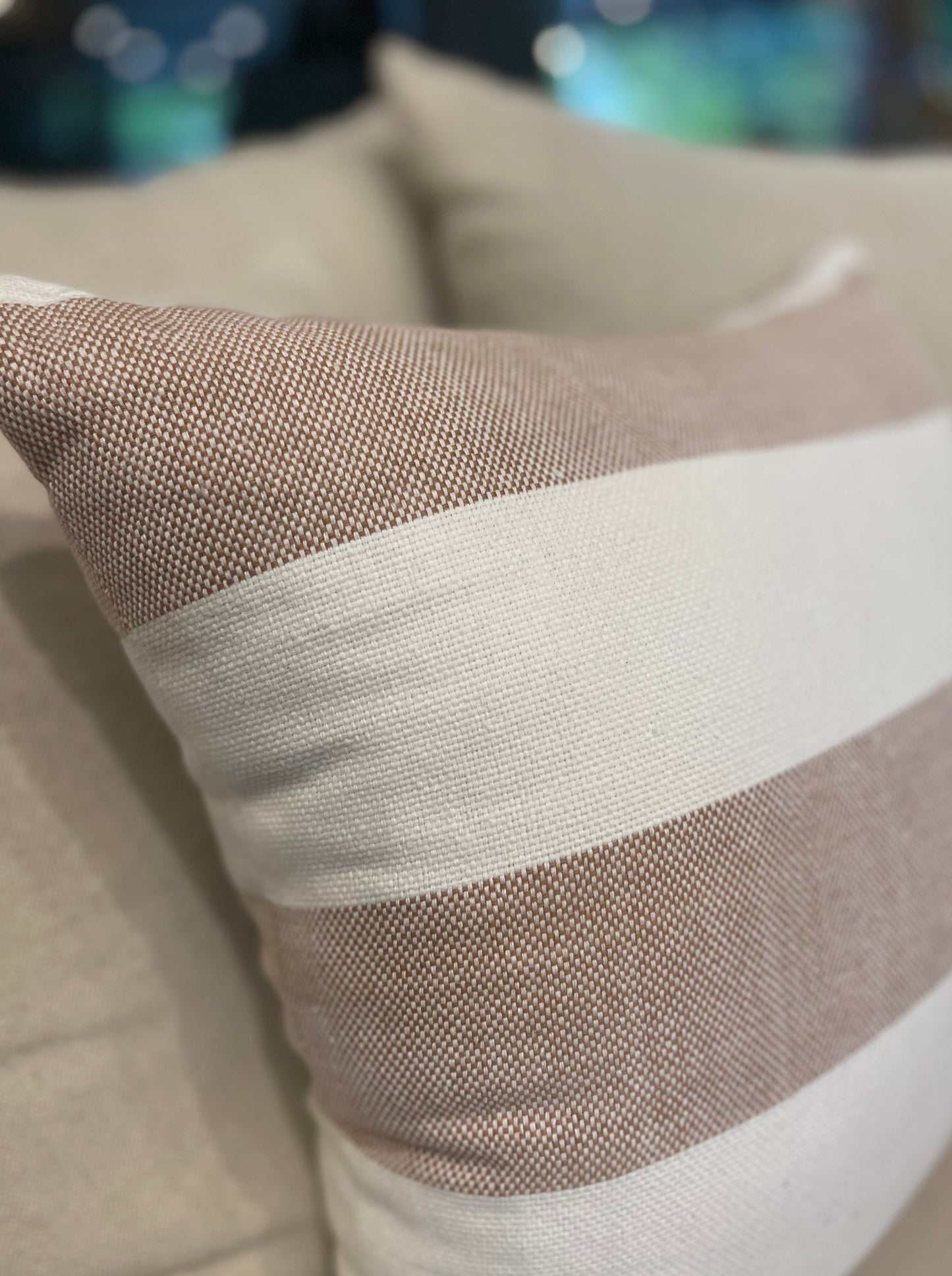 Our Lyon Handwoven Cotton Cushion boasts sleek stripes and provides versatile styling, ideal for complementing sofas and beds. Its luxurious Dacron insert adds additional comfort. Rust and white coloured.