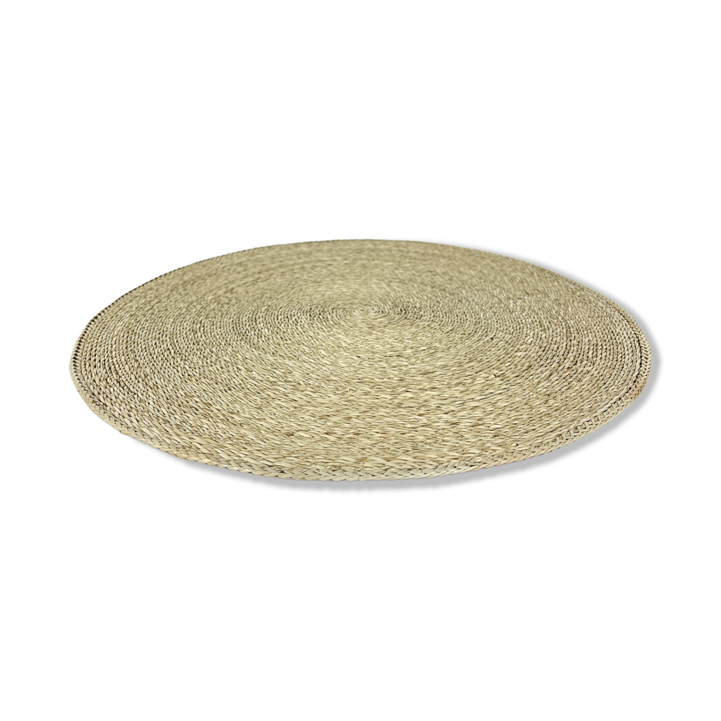 Our Handwoven Pandan Natural Round Placemat offer a great way to both decorate and protect your table. Angled side.