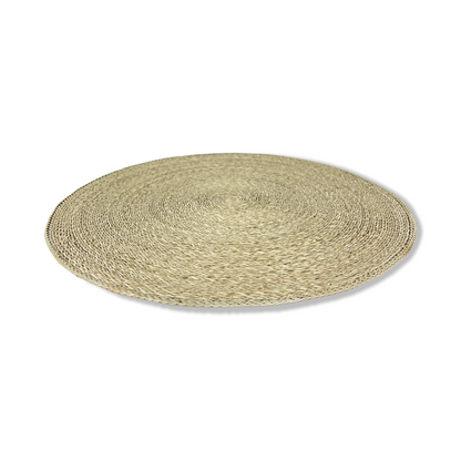 Our Handwoven Pandan Natural Round Placemat offer a great way to both decorate and protect your table. Angled side.