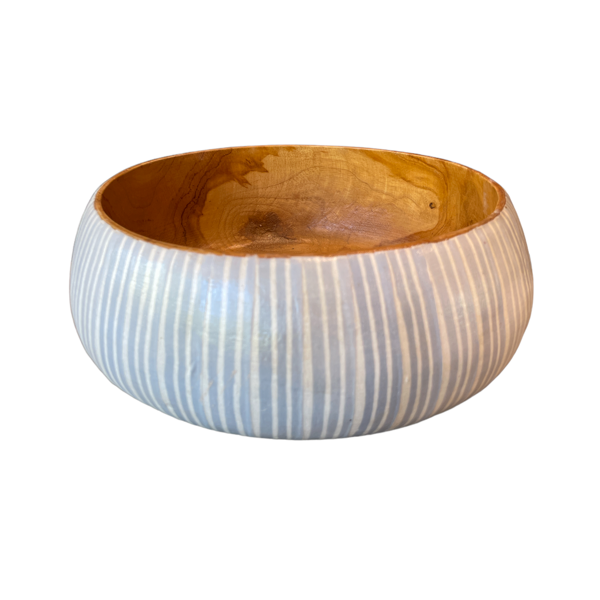 Artfully crafted, our Blue & White Batik Bowls lend just the right amount of texture and dimension to your table. Formed from teak wood, the warm reddish-brown hues and beautiful natural grains perfectly pair with the playful handcrafted Batik pattern. Side.