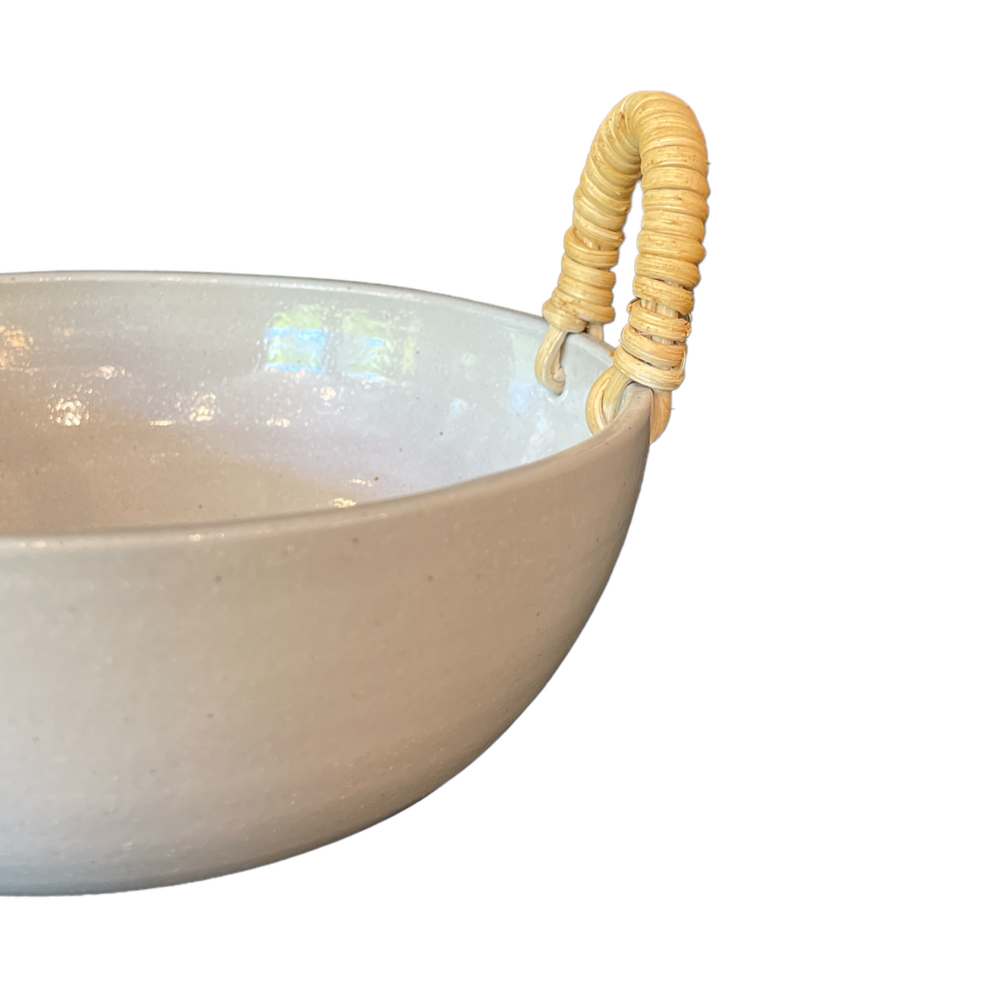 Our Rimbah Ceramic &amp; Rattan Bowl is a beautifully handmade, tactile piece, with qualities that are evident in its organic shape and distinctive glazed finish. The subtle cream stoneware accented by Rattan handles brings a stylish aesthetic to your table.