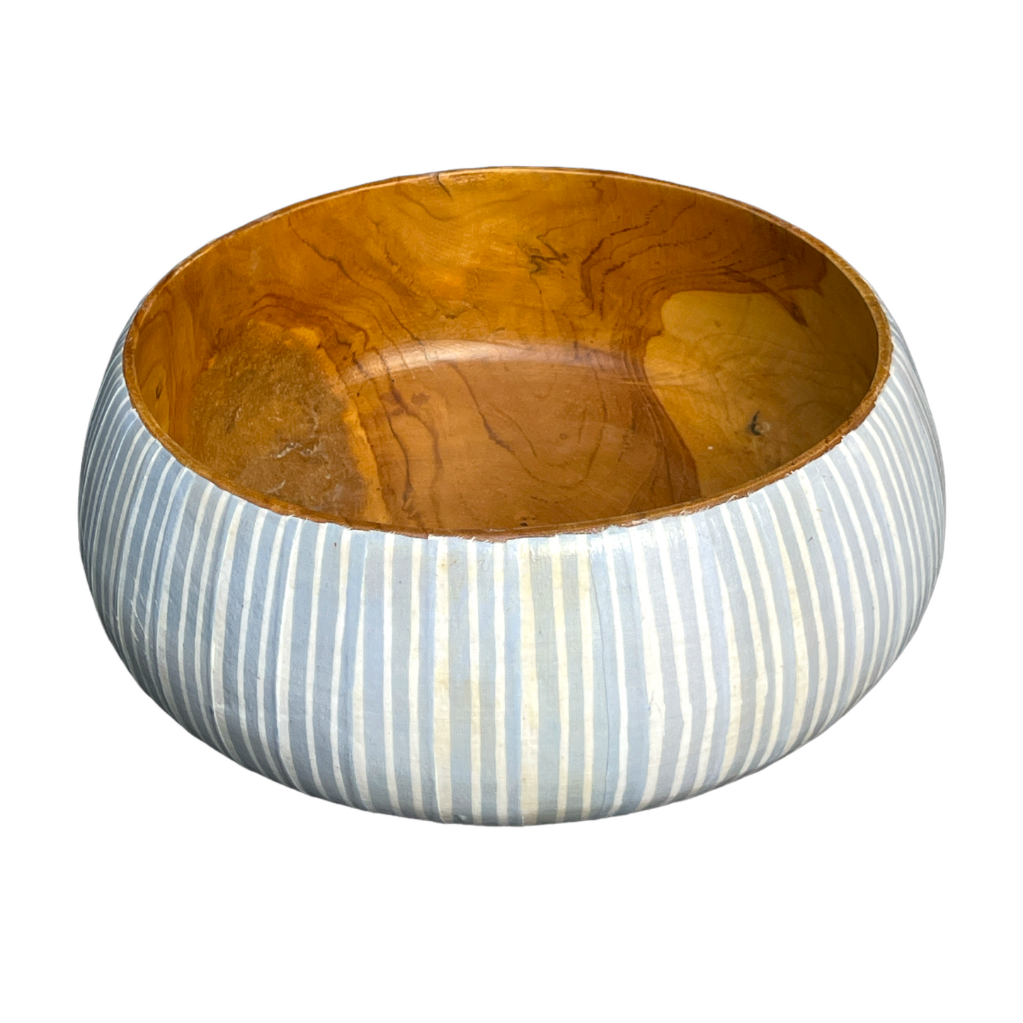 Artfully crafted, our Blue & White Batik Bowls lend just the right amount of texture and dimension to your table. Formed from teak wood, the warm reddish-brown hues and beautiful natural grains perfectly pair with the playful handcrafted Batik pattern. Front.