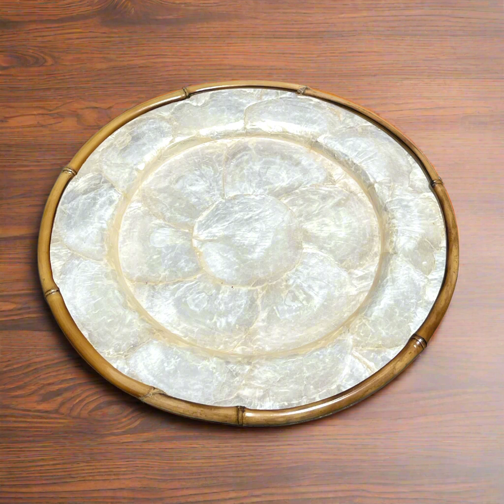 Elevate your dining experience and impress your guests with this stunning Round Capiz Charger Plate, guaranteed to add charm and elegance to any table setting.