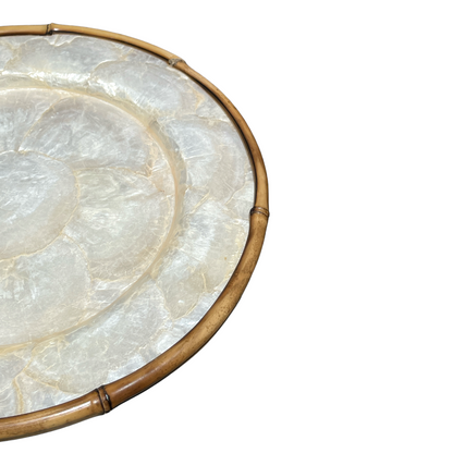 Elevate your dining experience and impress your guests with this stunning Round Capiz Charger Plate, guaranteed to add charm and elegance to any table setting. Close up detail.