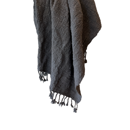 Transform your living spaces into cozy and inviting havens with our handwoven, raw cotton throw. The tassel edges and rustic texture add a touch of warmth and comfort to any room.