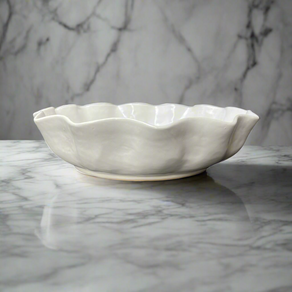 Our Cream Panuta Glzed Bowl is a beautiful handmade piece, with tactile qualities that are evident in its organic shape and distinctive glazed finish. The subtle cream stoneware brings a stylish aesthetic to your tabletop.