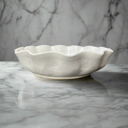 Our Cream Panuta Glzed Bowl is a beautiful handmade piece, with tactile qualities that are evident in its organic shape and distinctive glazed finish. The subtle cream stoneware brings a stylish aesthetic to your tabletop.