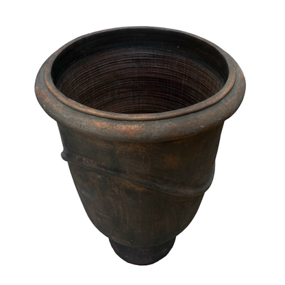 Indulge in the timeless design and rustic charm of this textured pot. Its classic shape and pared-back aesthetic give it a unique character that will enhance any space.