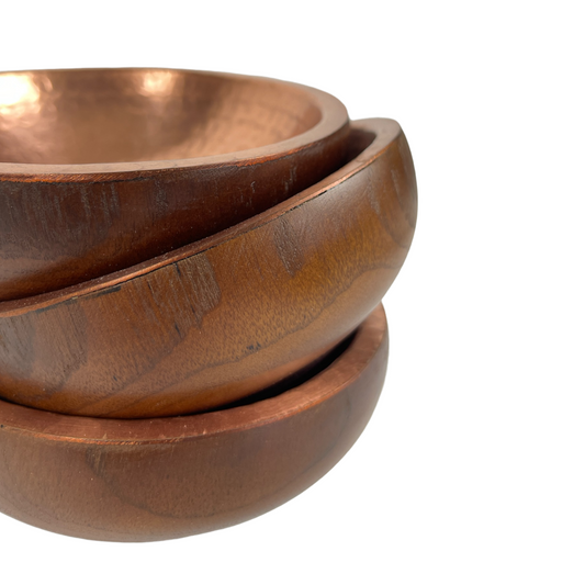 Capture attention with Ailan Teak Wood &amp; Copper Bowls. The combination of teak and copper creates a stunning texture and dimension for any space. A remarkable decorative addition in any room.