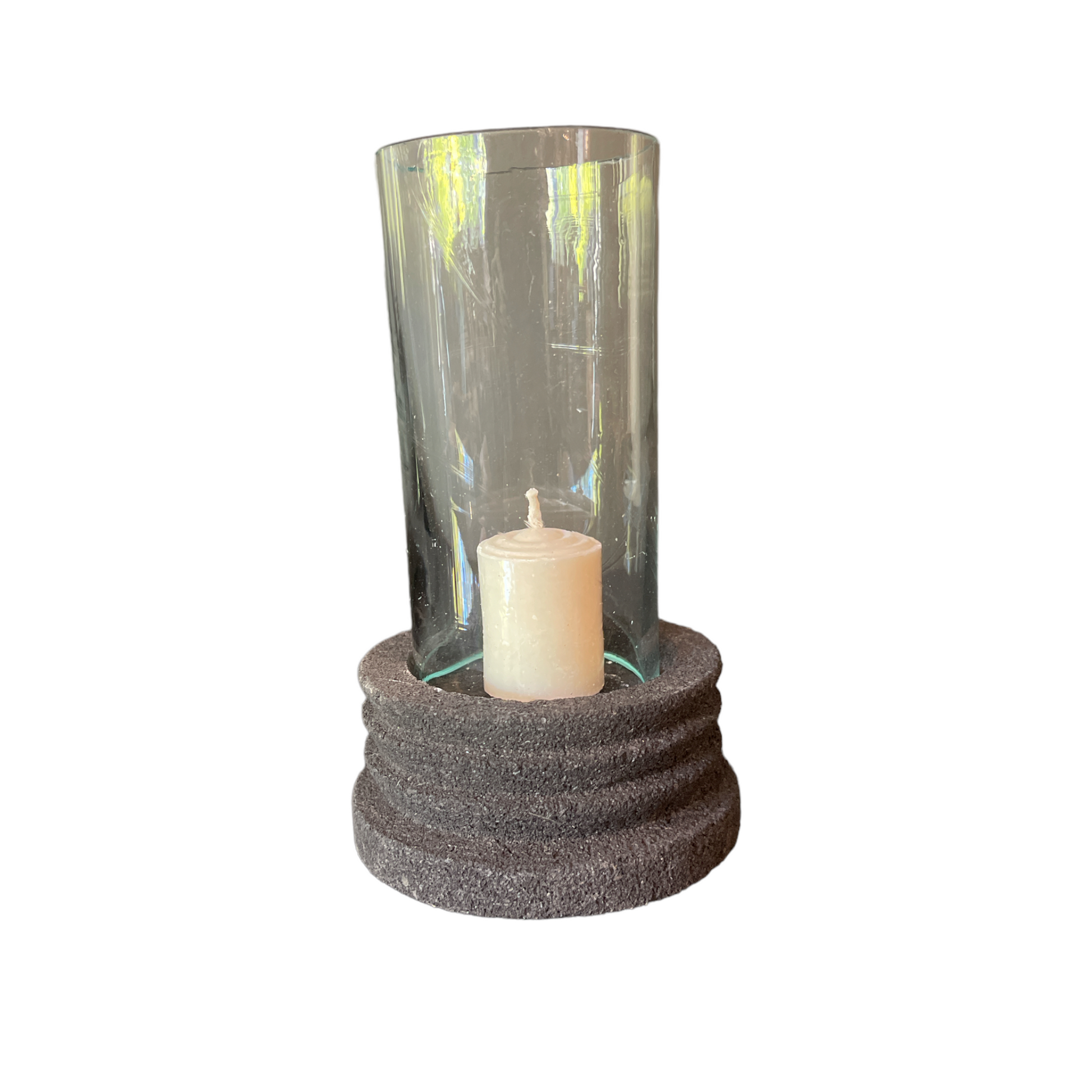 Experience the beauty of the Handmade Lava Stone Candle Holder with a glass cylinder. It will elevate any table and captivate as an ornamental piece using a single tealight.