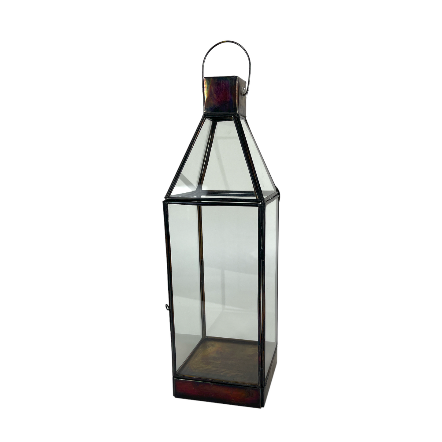 The Roro Brass & Glass Lantern is skilfully crafted from highly polished brass. The antique black metal finish perfectly complements the recycled glass panels. The lantern has a brass sheet base and simple carry handle. The glass door neatly opens with a simple pin fixing, allowing easy access to place a candle inside.