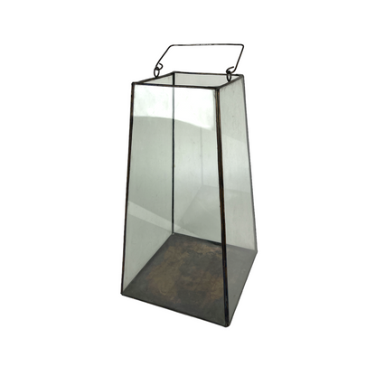 Add a touch of elegance to your dining table with our stunning Gemi Brass &amp; Glass Lantern. Made with expert craftsmanship using gleaming brass and eco-friendly recycled glass, it creates a distinctive ambiance in any home.