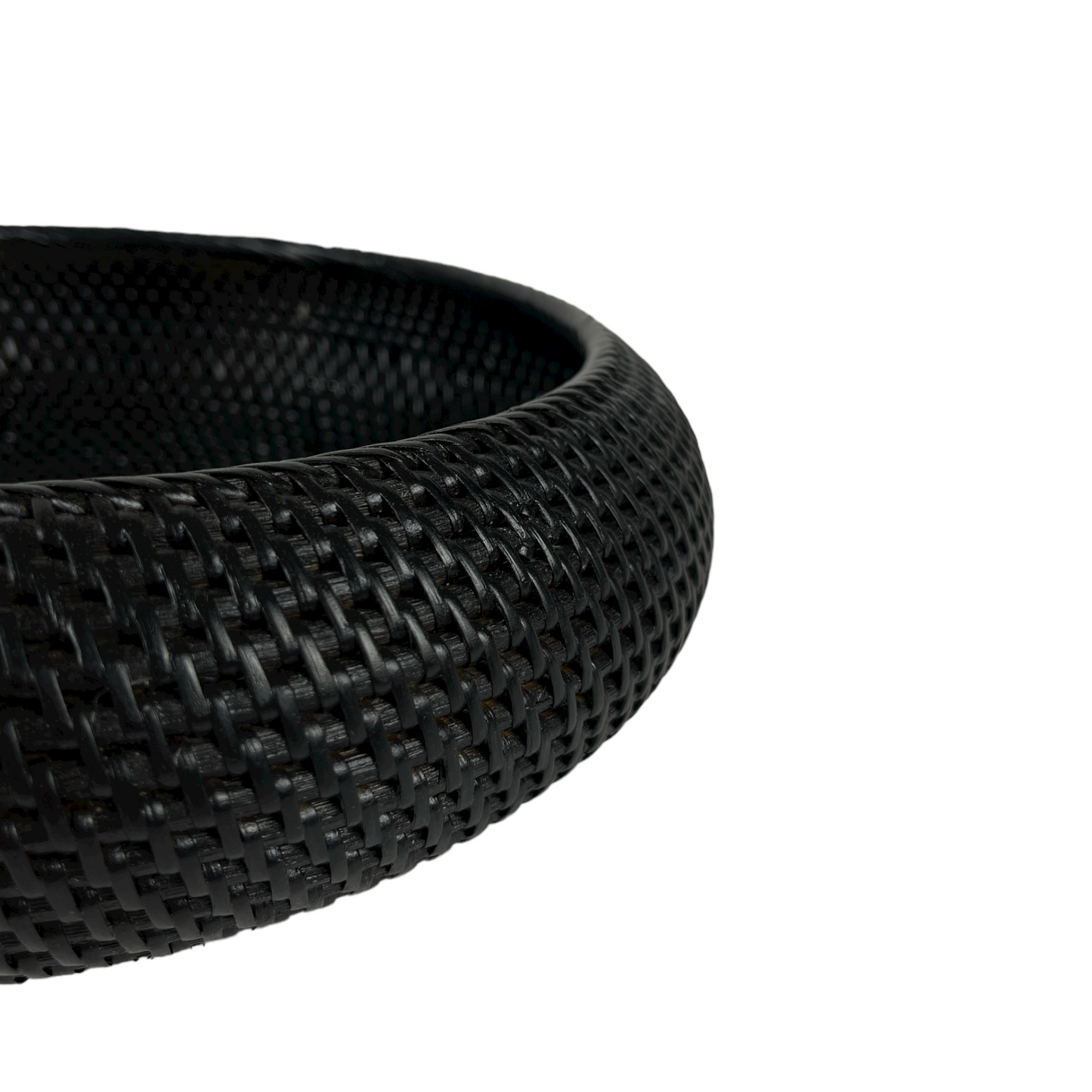Get ready to elevate your home decor with our Bergaya Black Rattan Bowl. Carefully crafted with an artful touch, this stylish piece will add a beautiful texture to any room, instantly capturing attention and admiration. Detail.